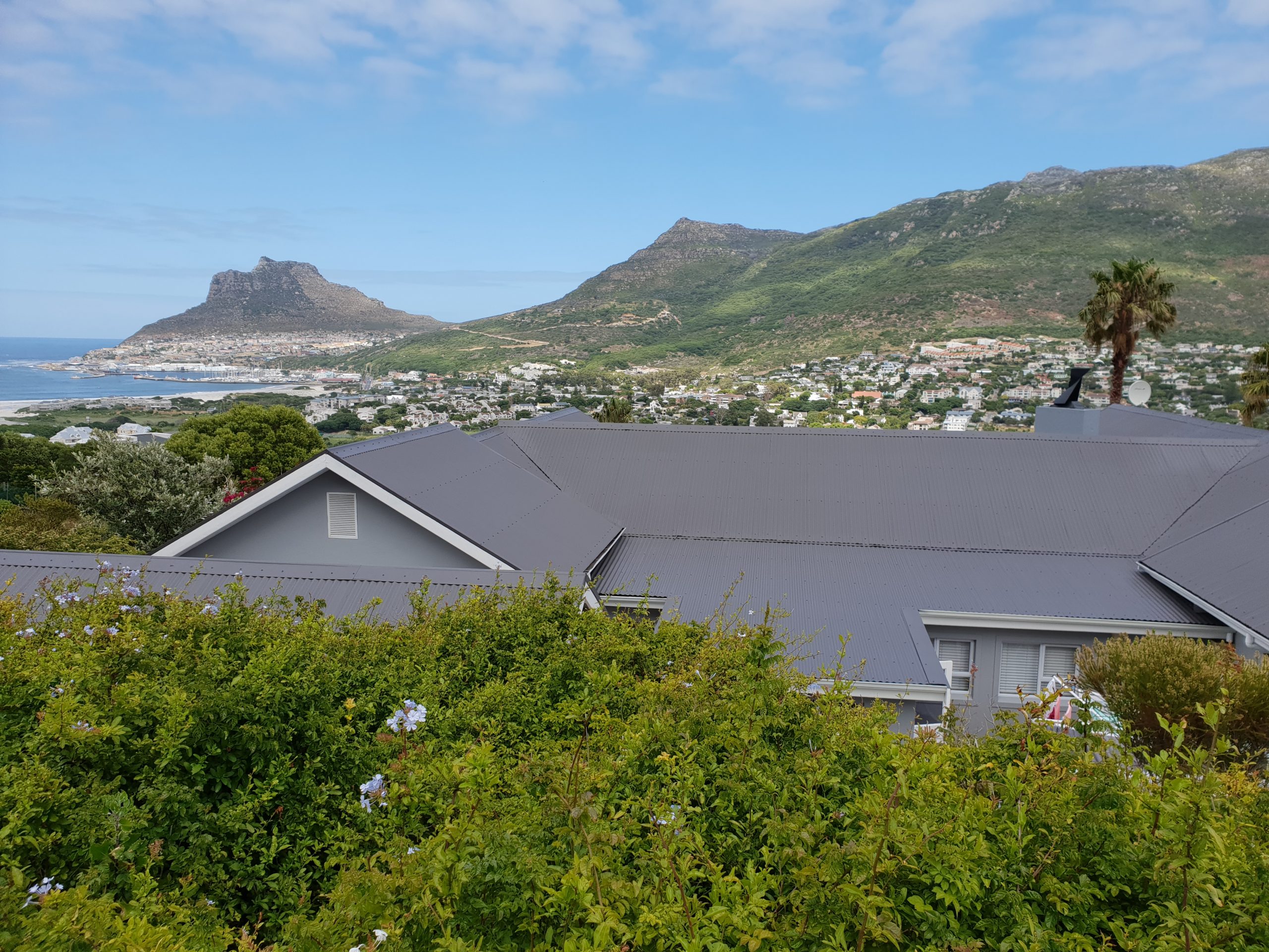 Completed grey roof with Cape Town mountains beyond