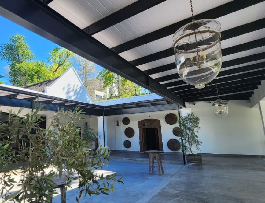 Covered outdoor patio with black beams