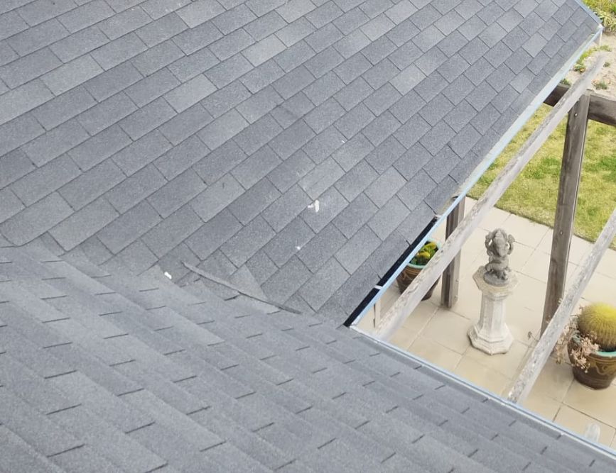 Close view of a grey asphalt shingle roof