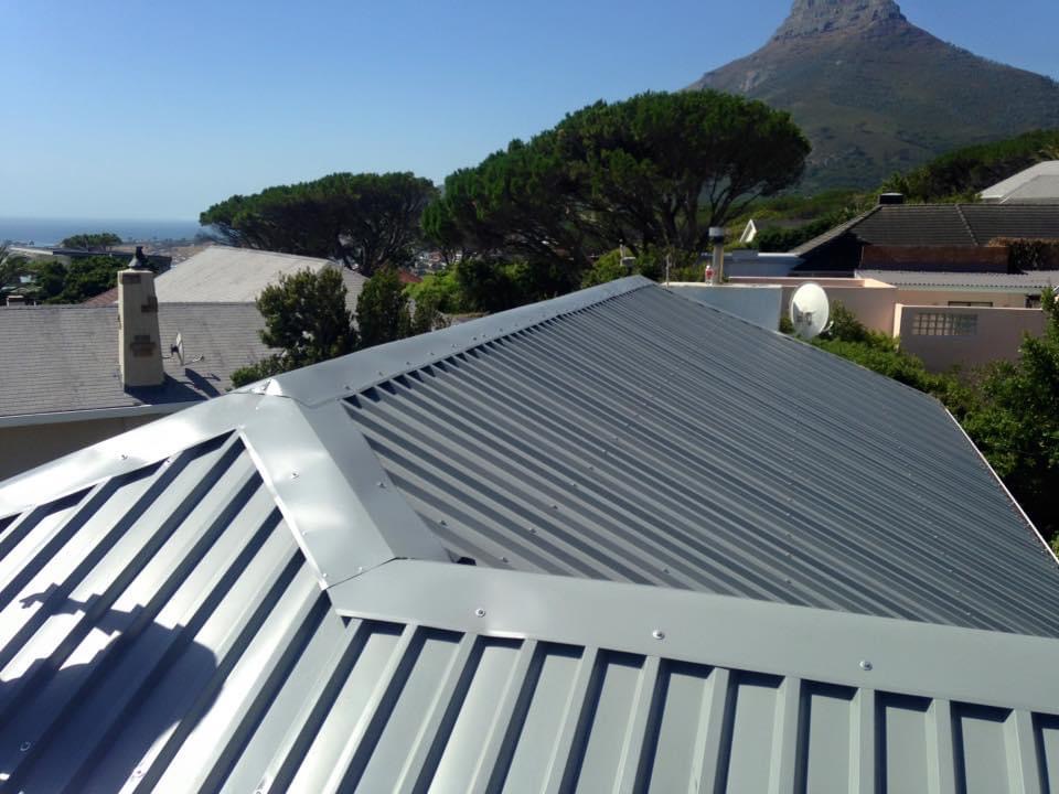 Completed metal roof with Cape mountain and ocean views