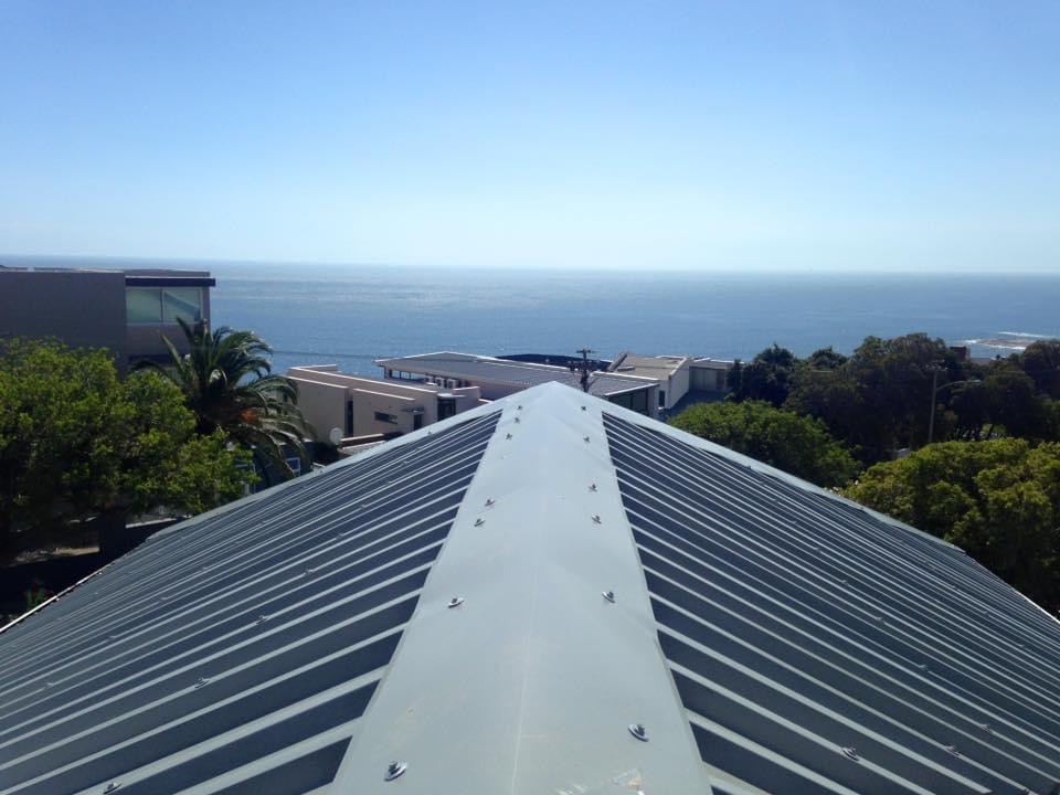 Metal roof ridge pointing towards the Cape coast
