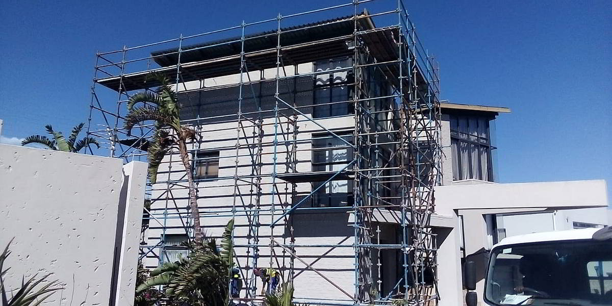 Building with scaffolding during roof work
